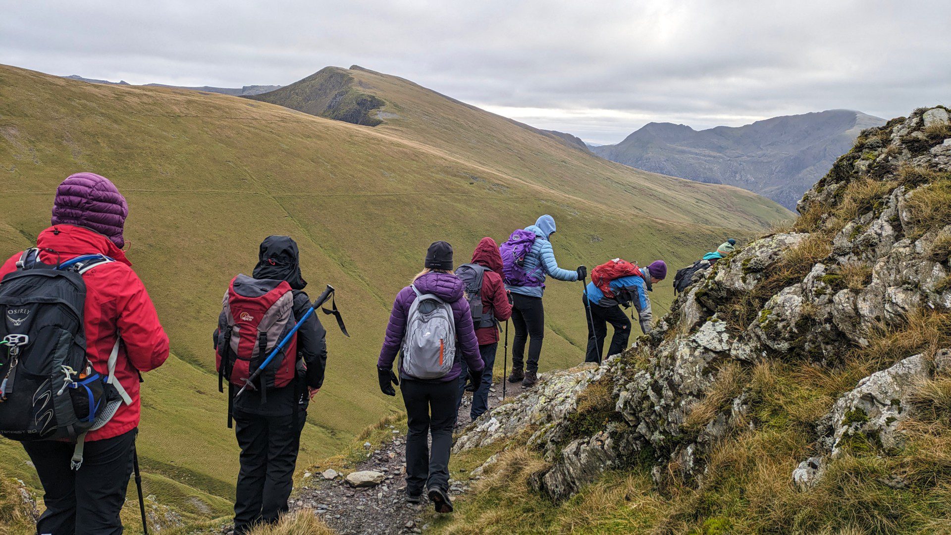 Women walking along an exposed path on Elidir Fawr